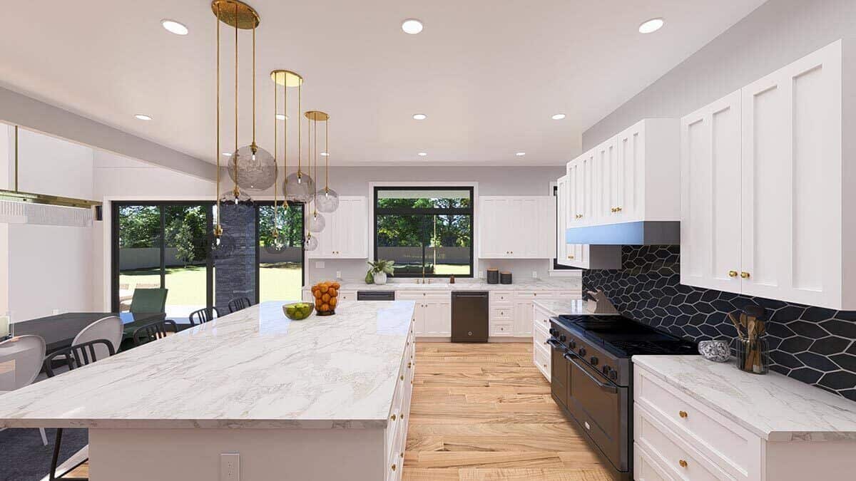 Recessed ceiling lights along with glass pendants suspended over the island illuminate the kitchen.