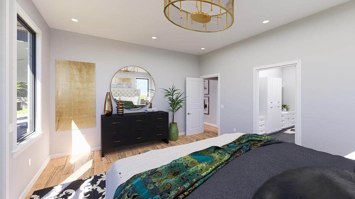 The primary bedroom includes a black dresser and an ensuite bath.