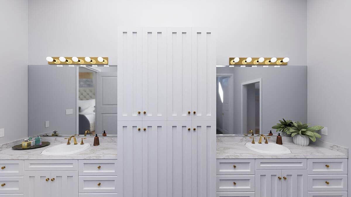 The primary bathroom features his and her sink vanities separated by a linen closet.