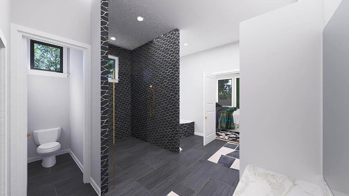 A soaking tub and a water closet on either side of the walk-in shower complete the primary bathroom.