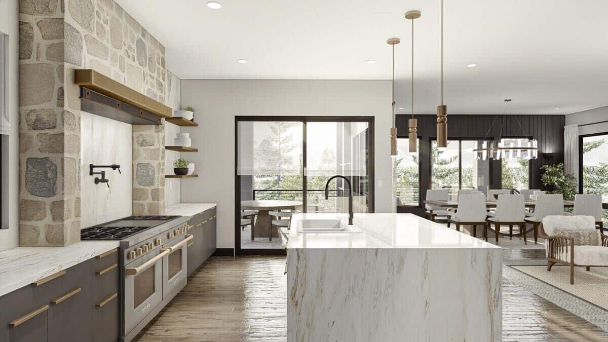 Sliding glass doors at the back extend the kitchen onto a covered deck.