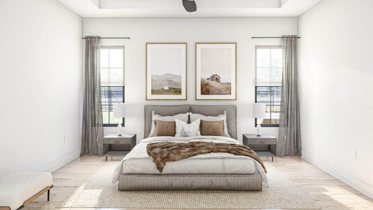 Primary bedroom with a platform bed flanked by wooden nightstands.