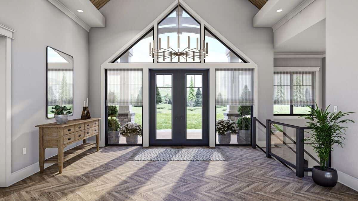 The French entry door opens into a spacious foyer with a cathedral ceiling and parquet flooring.