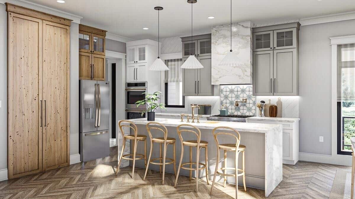 The kitchen features custom cabinetry, marble counters, and a waterfall island lined with wooden bar stools.