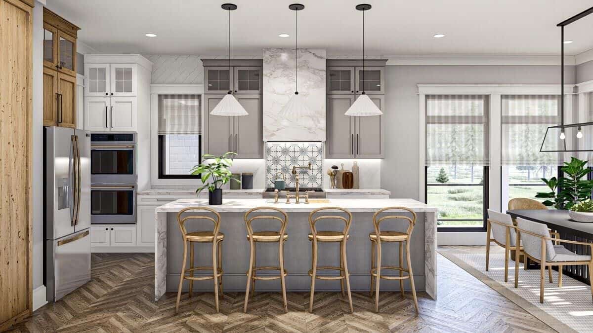 Aluminum-framed windows and wrought iron pendants suspended over the island brighten the kitchen.