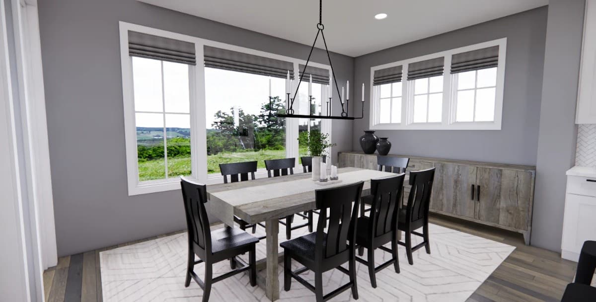 The dining room has a buffet table, a wooden dining set, and an excellent view of the backyard.