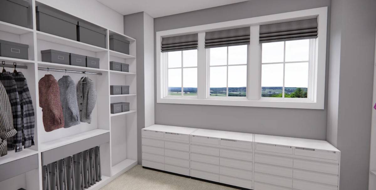 The primary walk-in closet offers lots of storage, a bench, and ample natural light streaming in through the framed windows.