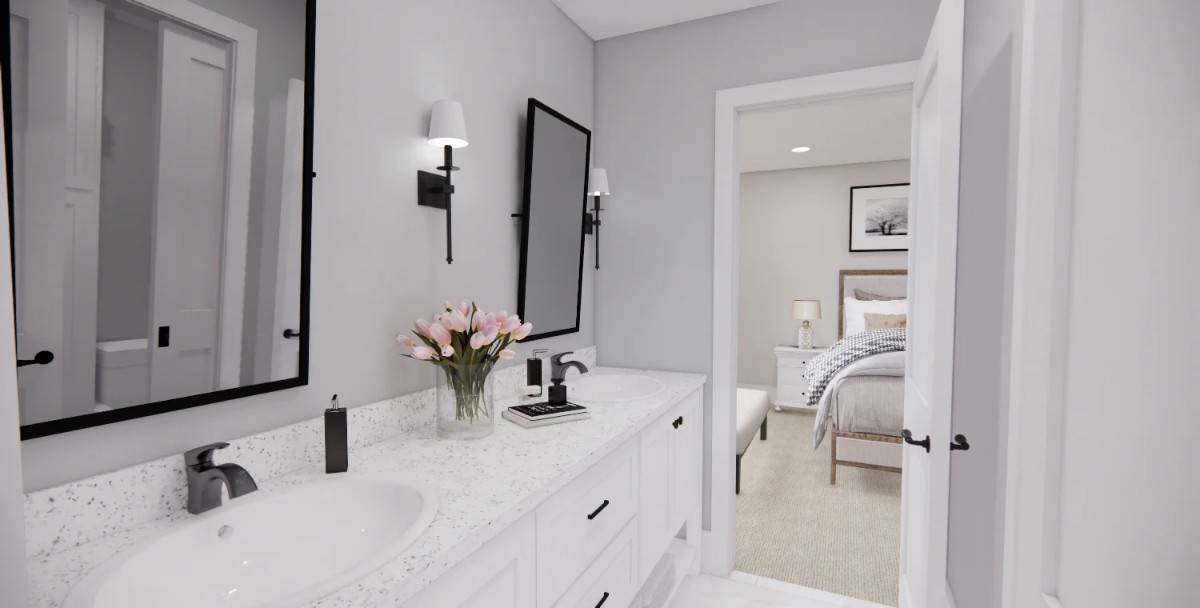 This bathroom with dual sinks connects two of the family bedrooms.