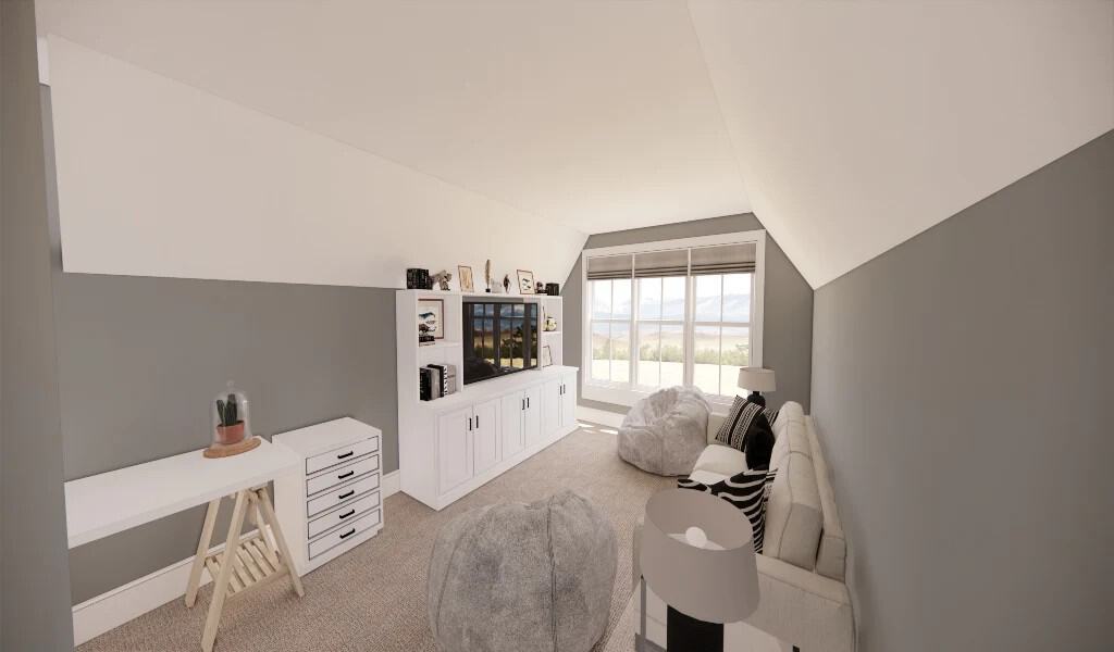 The bonus room is filled with white cabinets, a TV, and gray seats under a vaulted ceiling.