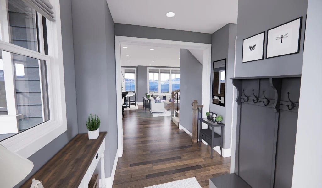 The foyer has a coat rack, a wooden console table, and a view of the open living space beyond.