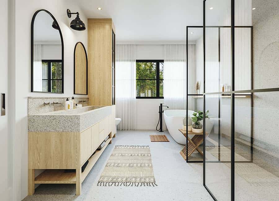 A large vanity with a trough sink, arched mirrors, and an attached linen closet completes the primary bathroom.