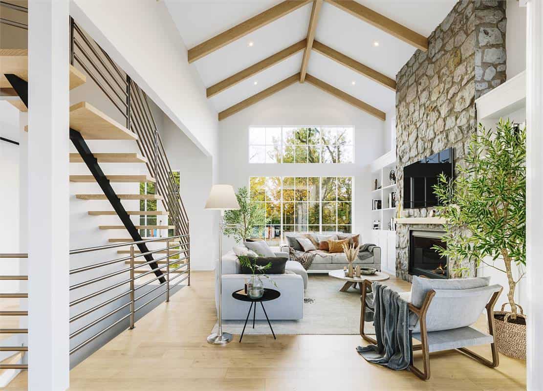 A cathedral ceiling framed with exposed beams crowns the living room.