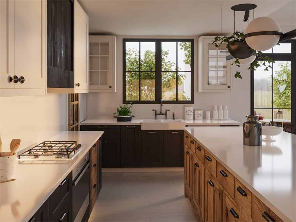 The kitchen is equipped with a farmhouse sink, contrasting cabinets, and a large breakfast island.