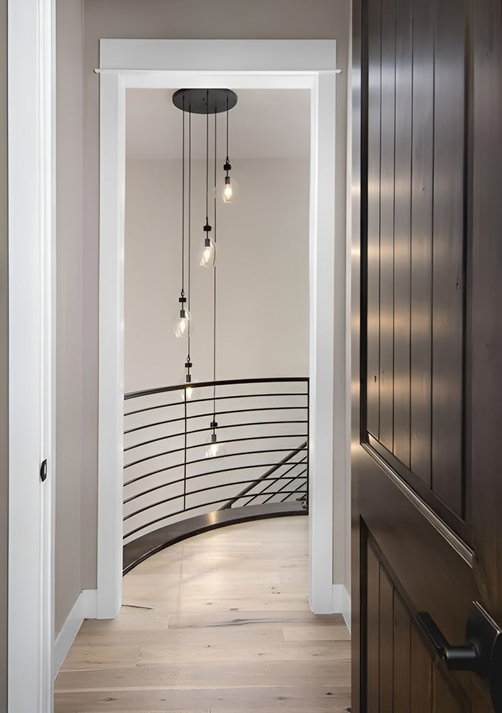 Staircase with wrought iron railings leading to the basement.