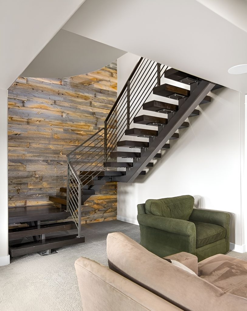 The basement has carpet flooring and wood-paneled accent wall.