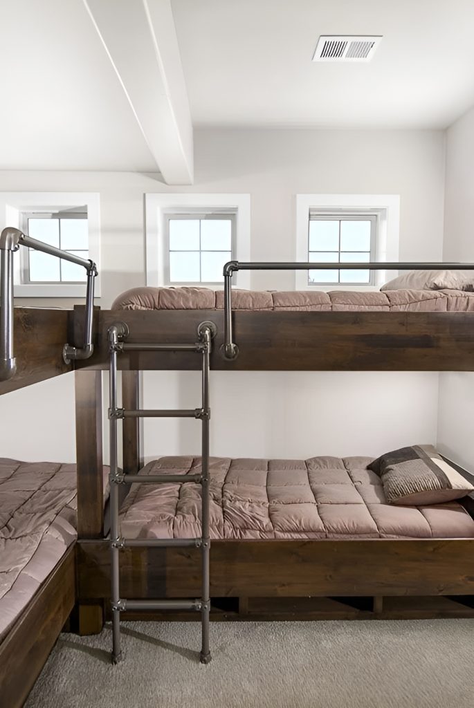 This bedroom offers built-in bunk rooms for guests.