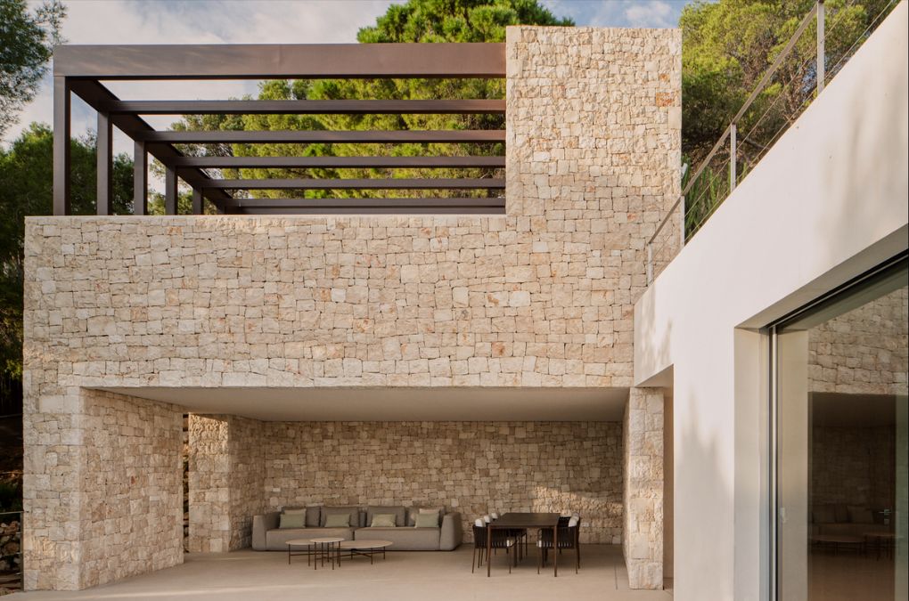 A patio with a couch and table