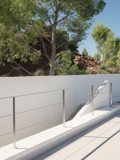 A staircase and a white fence