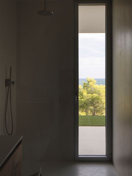 A bathroom with glass door