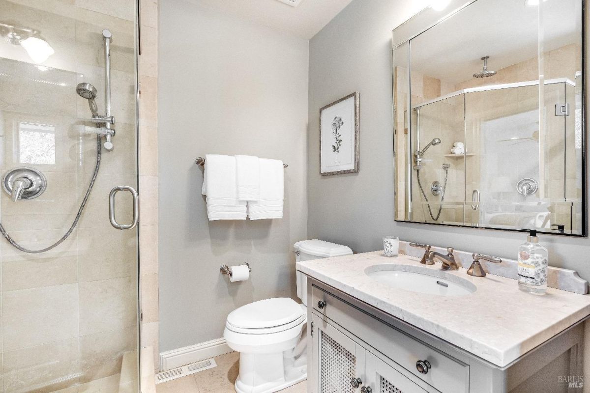 Bathroom with a sink, shower and a toilet.