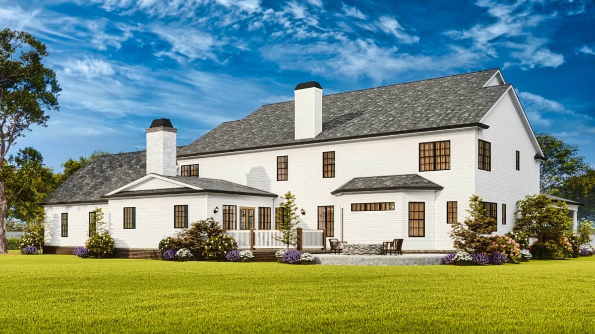 Rear view with stone chimneys and an open deck.