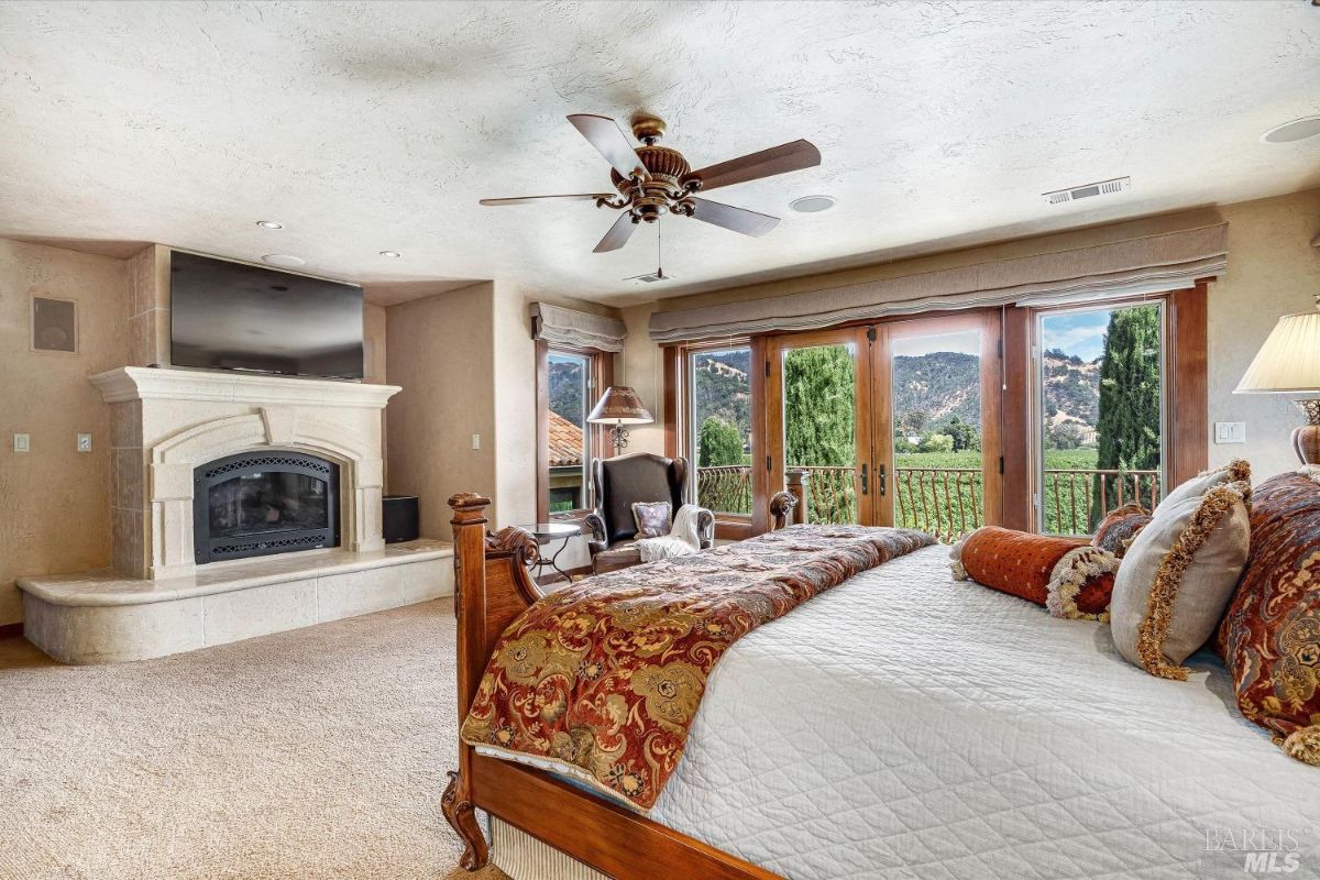 Bedroom with a fireplace.