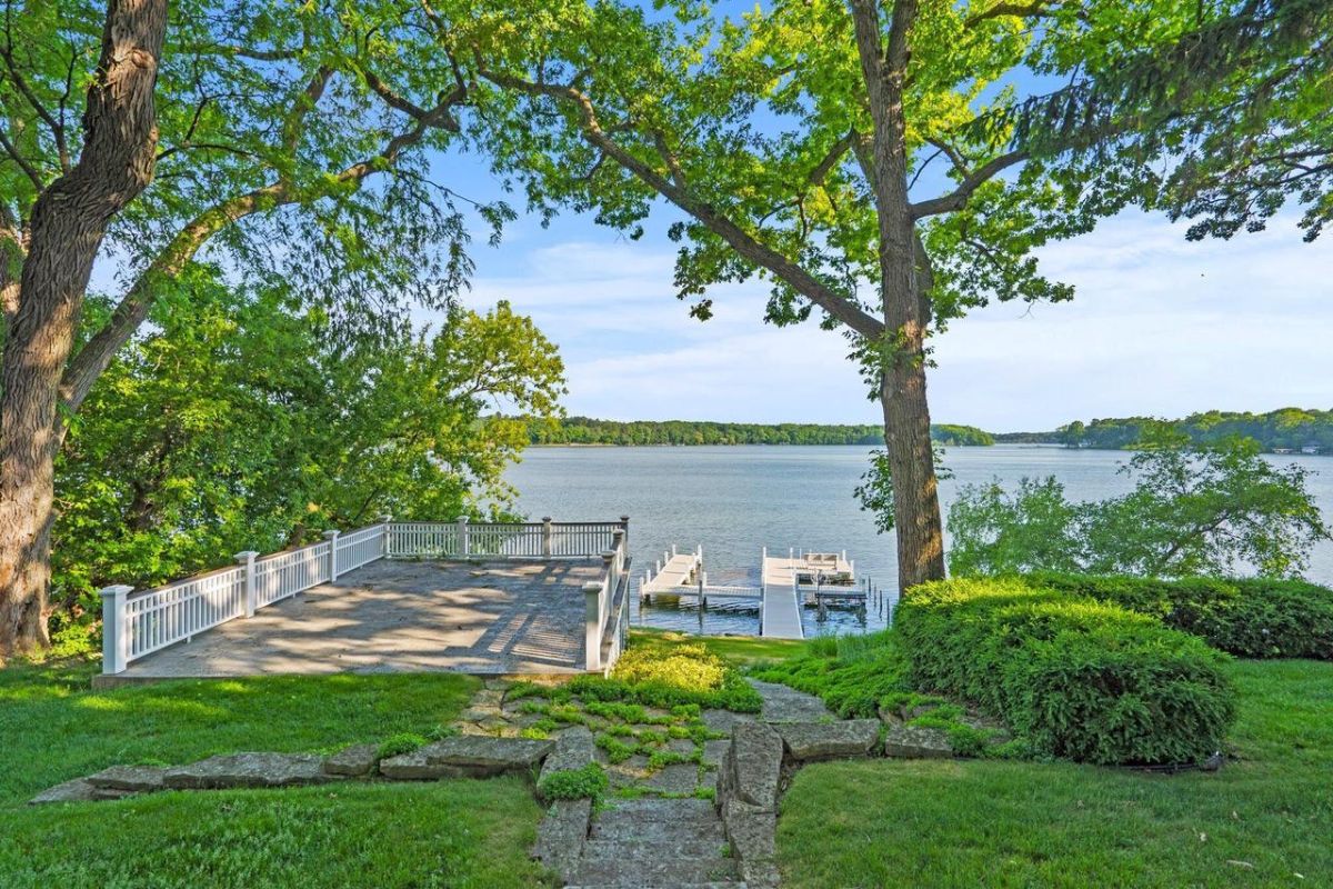 View deck overlooking the dock on the shore of a lake.