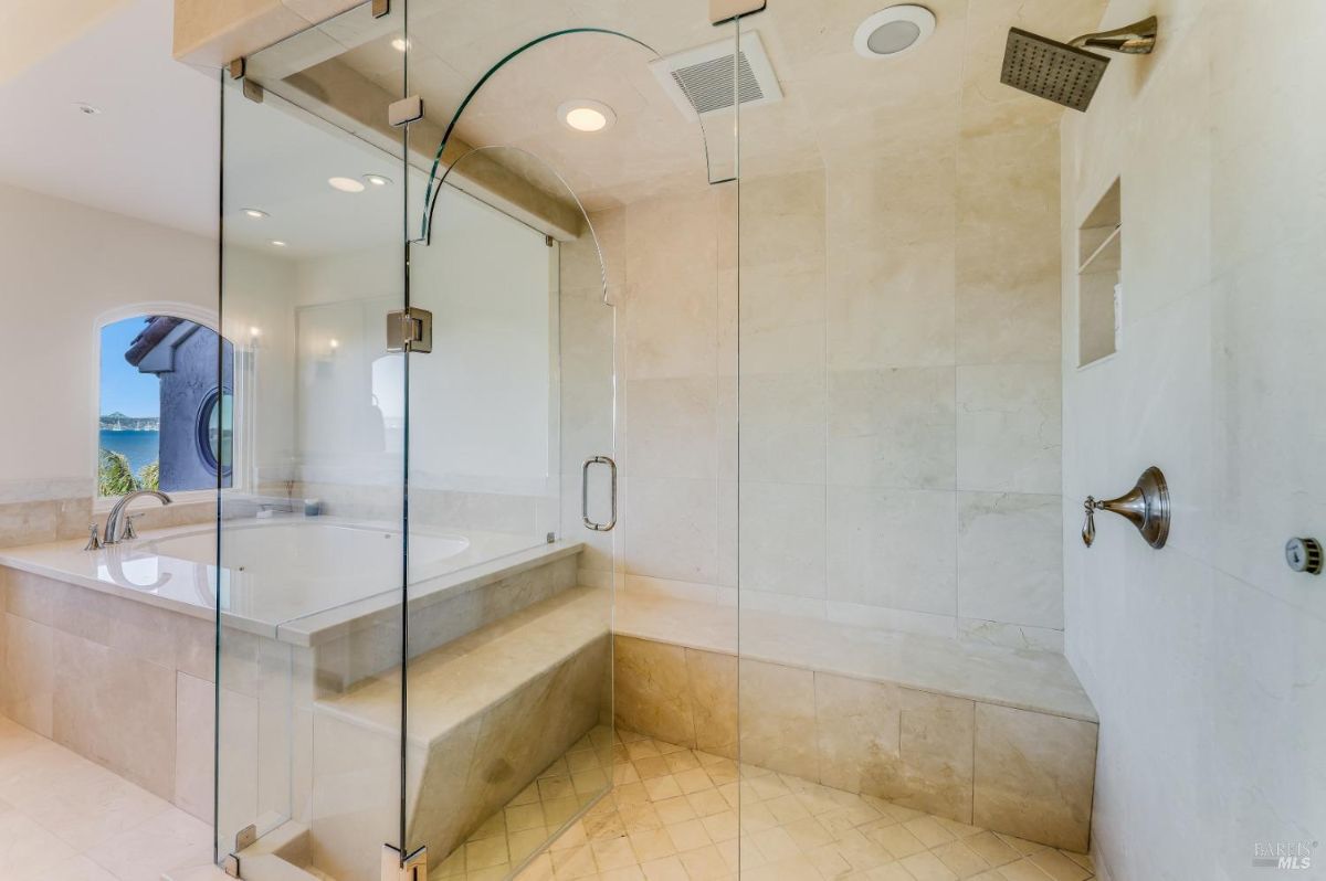 Bathroom with a walk-in shower and a soaking tub.