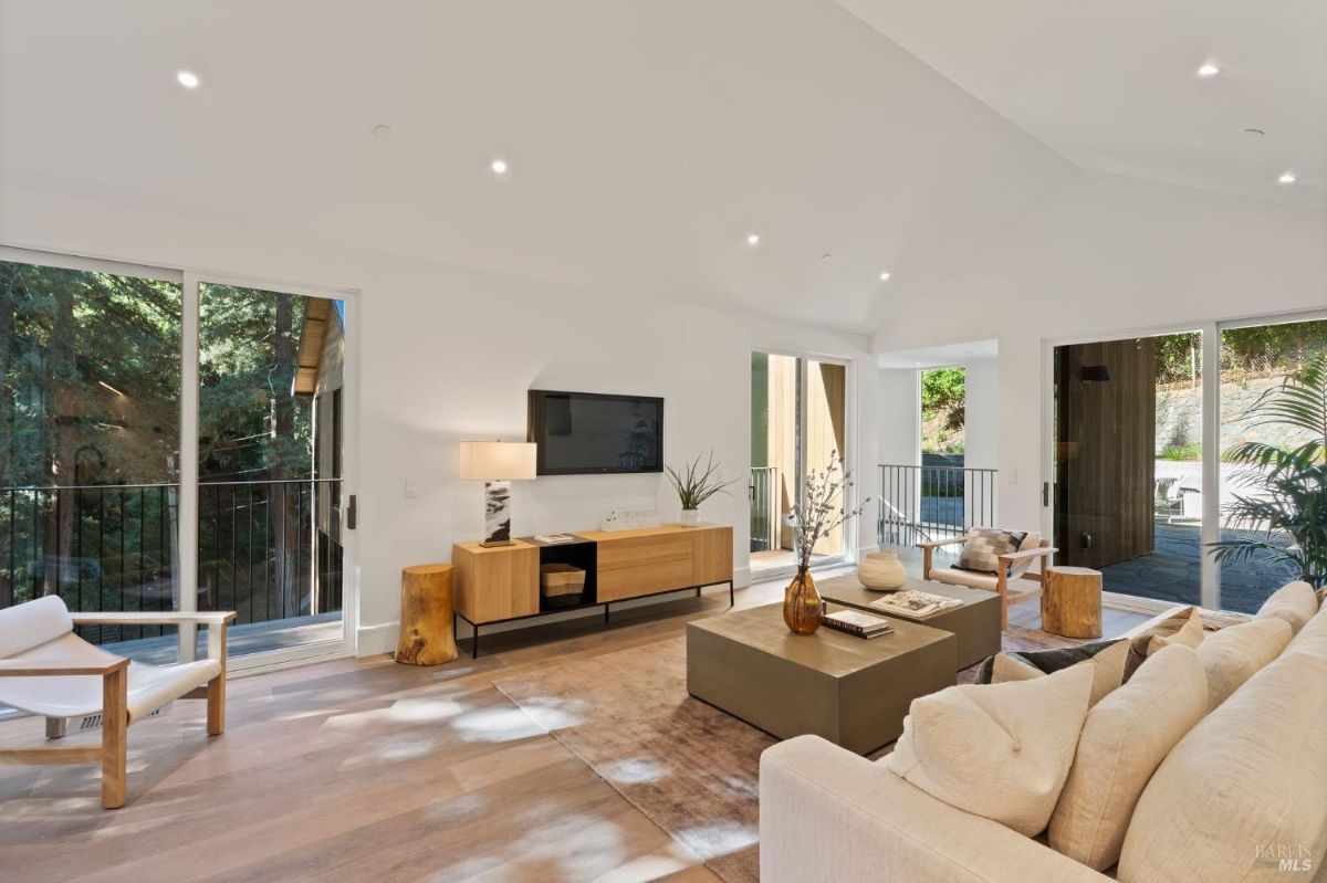 Family room with couches and a TV.