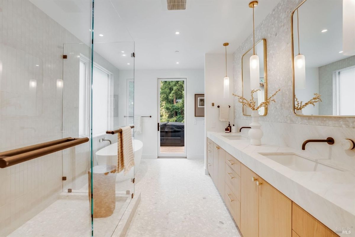 Bathroom with a sink, soaking tub and walk-in shower.