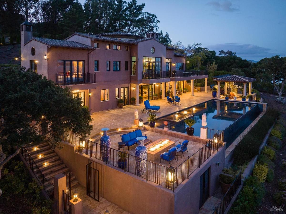 Rear view of the house with a pool.