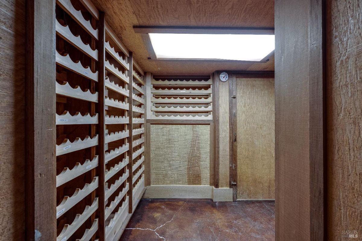 Wine cellar with wooden wine racks.