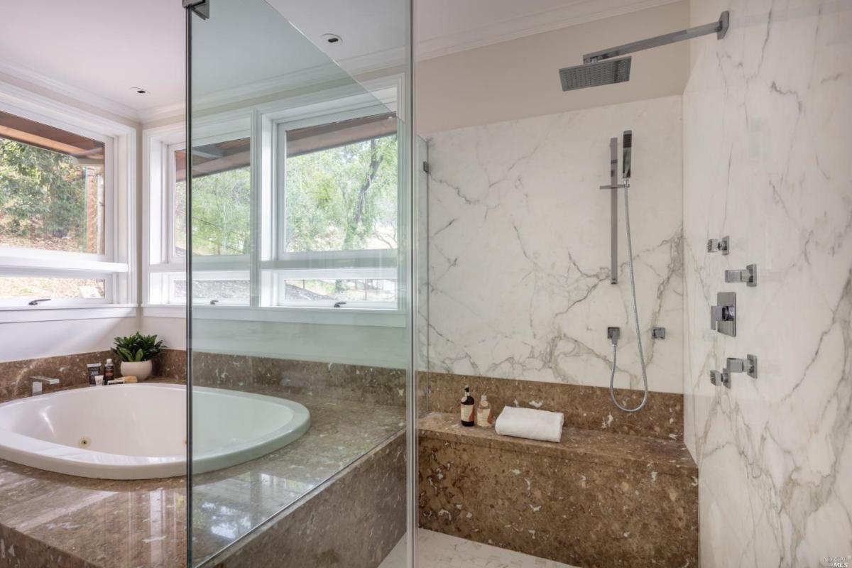 Bathroom with soaking tub and a shower.