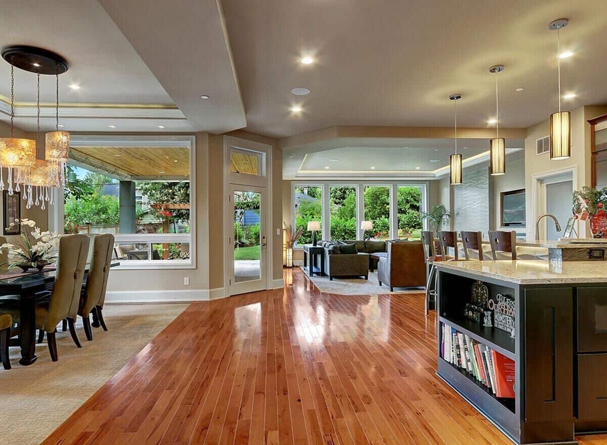 An open layout view of the kitchen, dining room, and great room from the foyer.