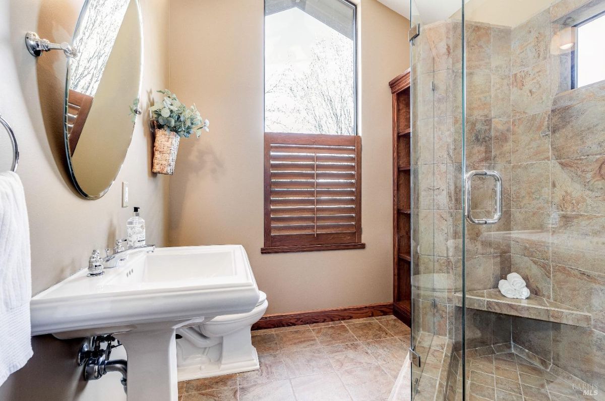 Bathroom with a sink, shower and a toilet.