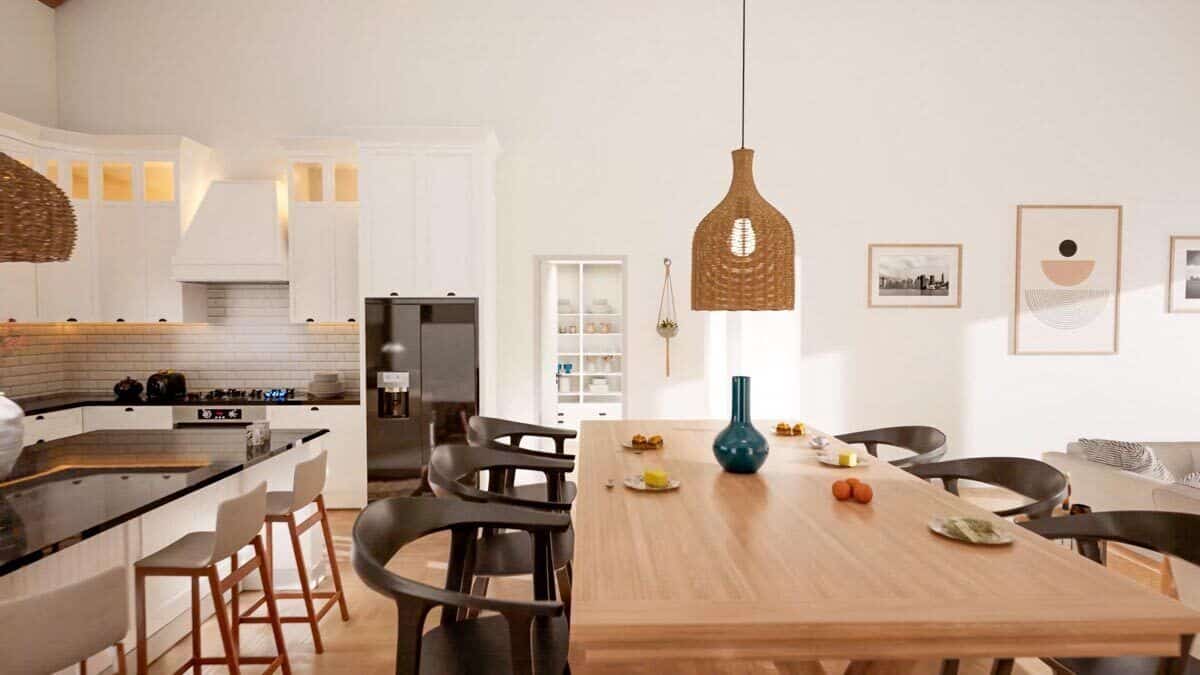 Dining area with round-back chairs and a wooden table topped with a wicker pendant light.