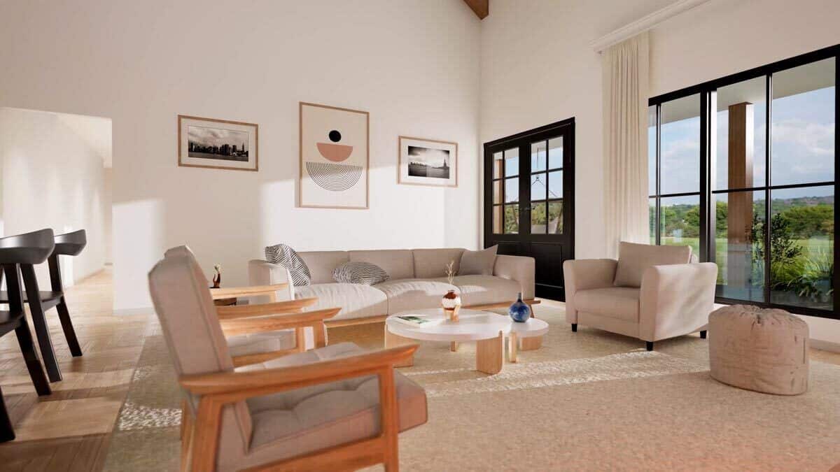 Great room with beige seats and nesting coffee tables over a shaggy area rug.