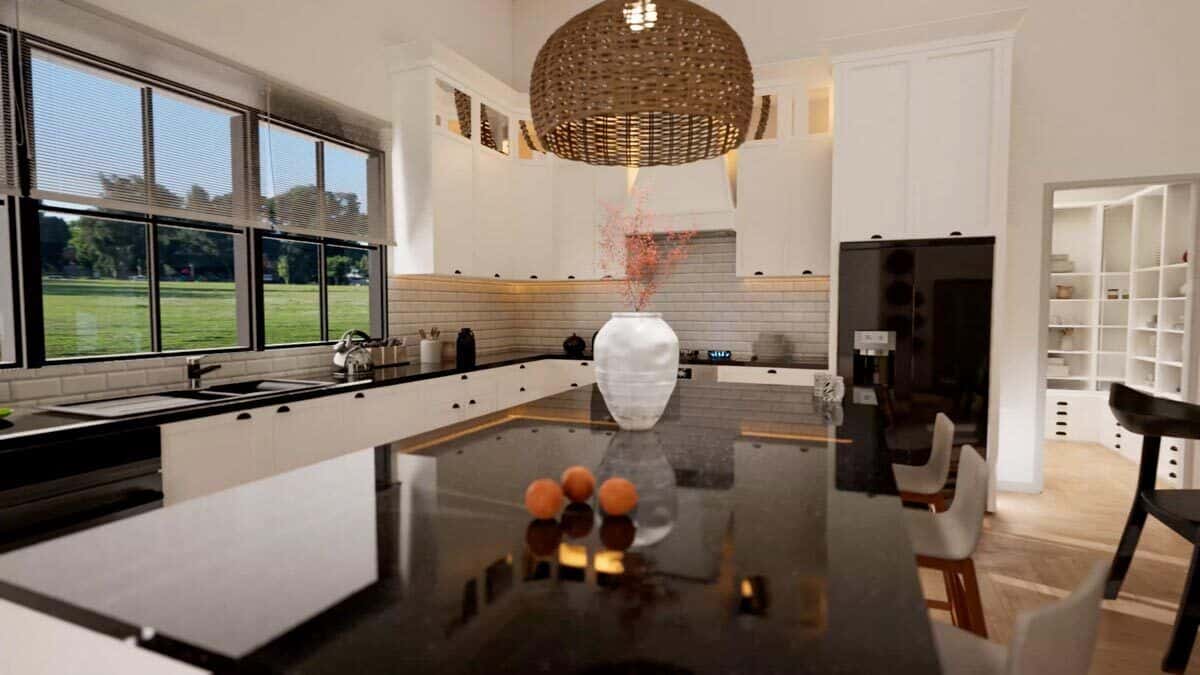 Kitchen with white cabinets, contrasting appliances, and a center island with bar seating.