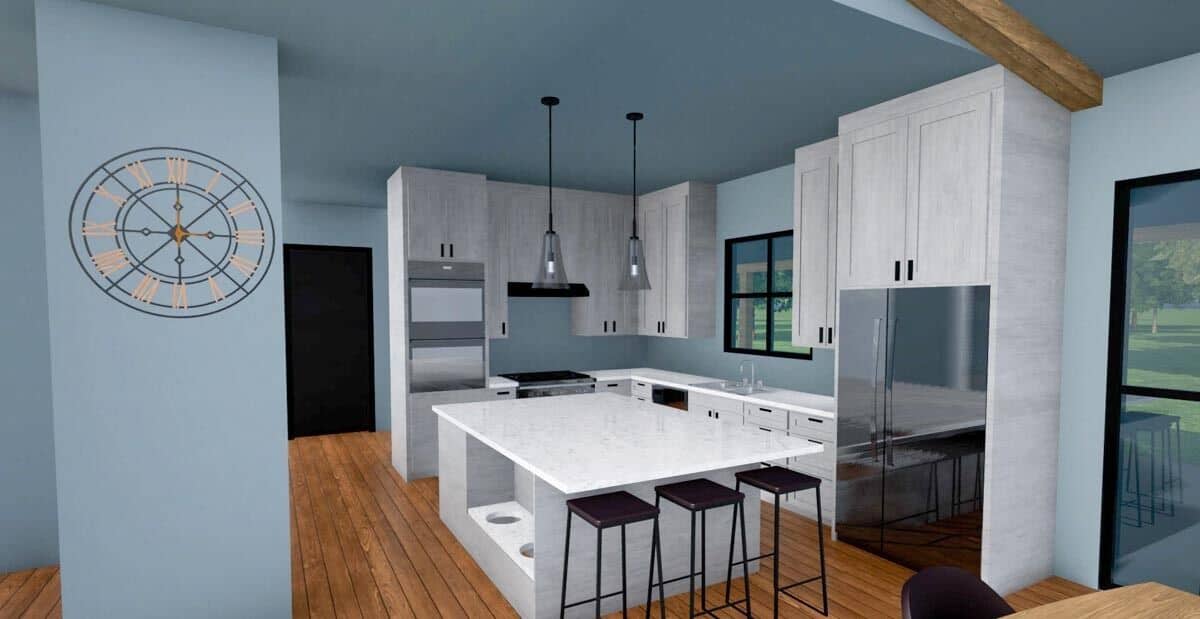 Kitchen with white cabinetry, modern appliances, and a center island with three seating.