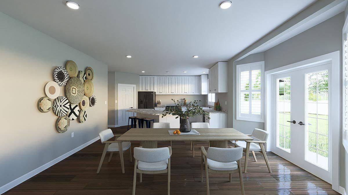 Dining area with a 6-seater dining set and a French door that opens to the rear patio.