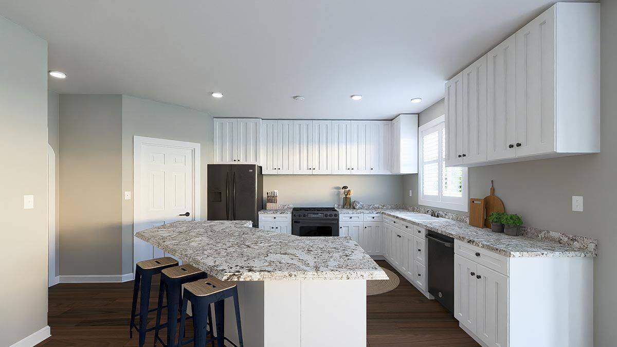 Kitchen with white cabinetry, contrasting appliances, a corner pantry, and an angled island.