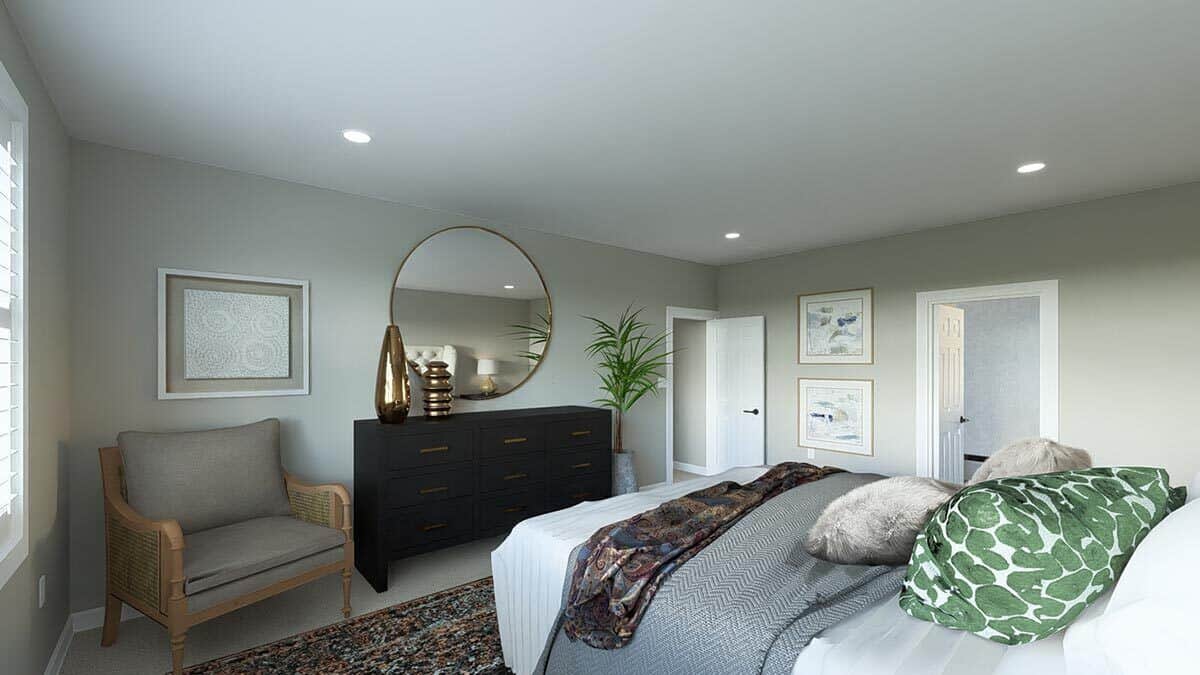 The primary bedroom includes a rattan chair and a dark wood console table adorned with a round mirror.