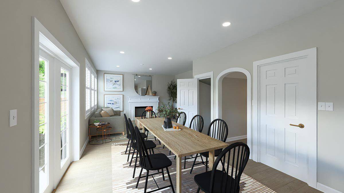 Dining area with a wooden table surrounded by black chairs.