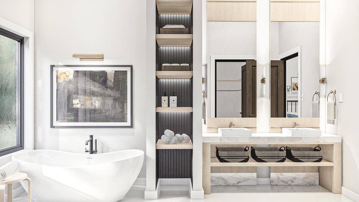 Primary bathroom with a freestanding tub, built-in shelves, and dual vanities with vessel sinks and tall mirrors.