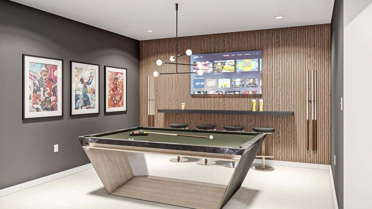 Rec room with a billiards table, a bar, and a wall-mounted TV.