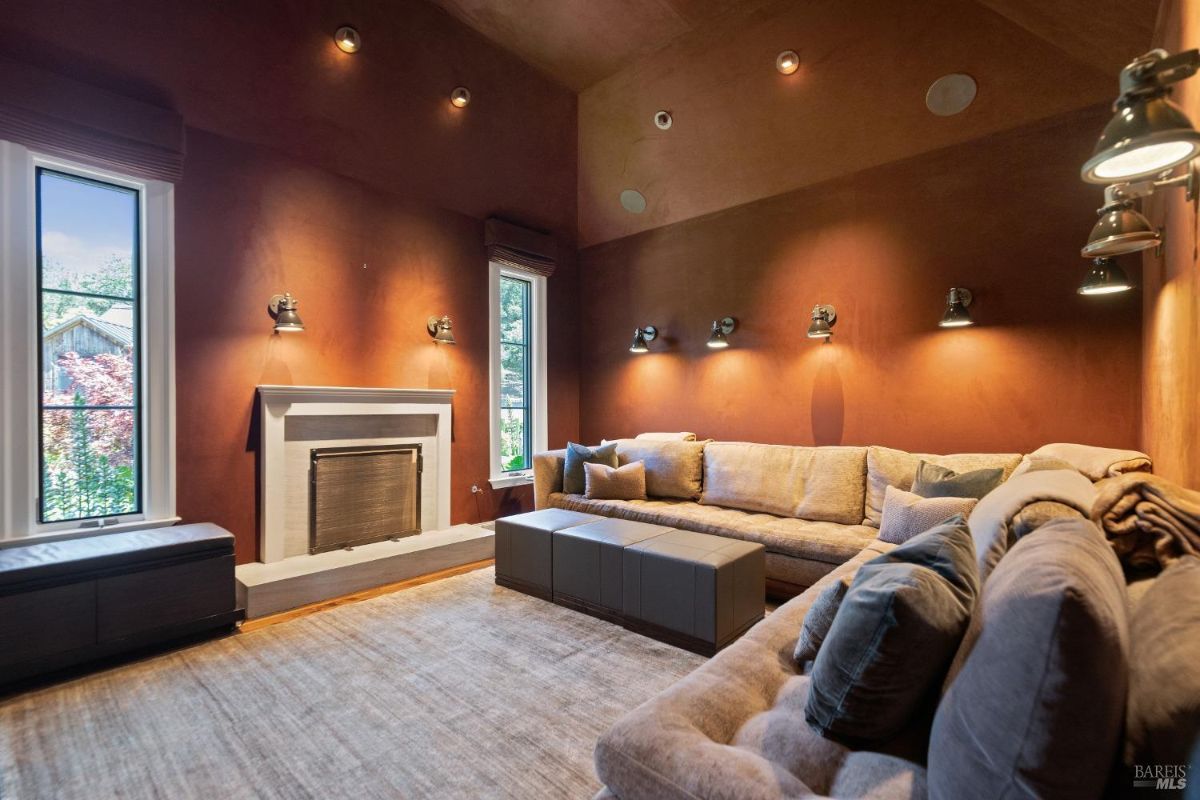 Family room with couches and a fireplace.