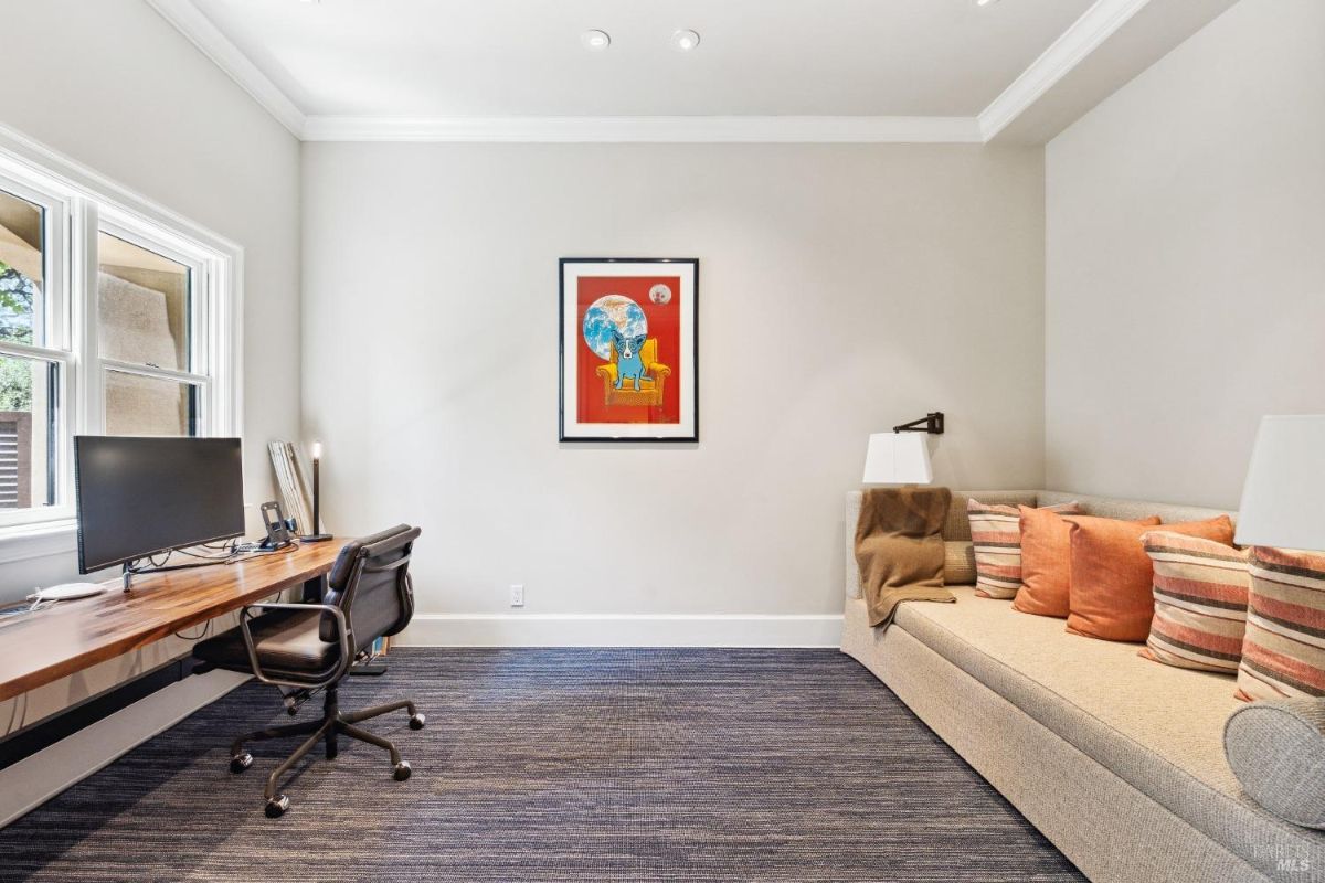 Home office with carpet flooring.