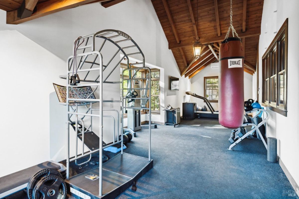 Home gym with workout equipment.