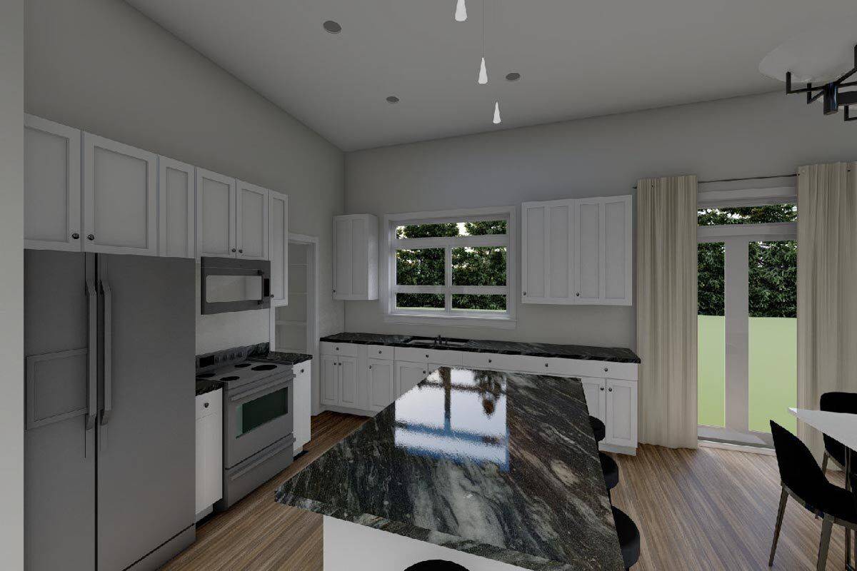 Kitchen with white cabinetry, marble countertops, and slate appliances.