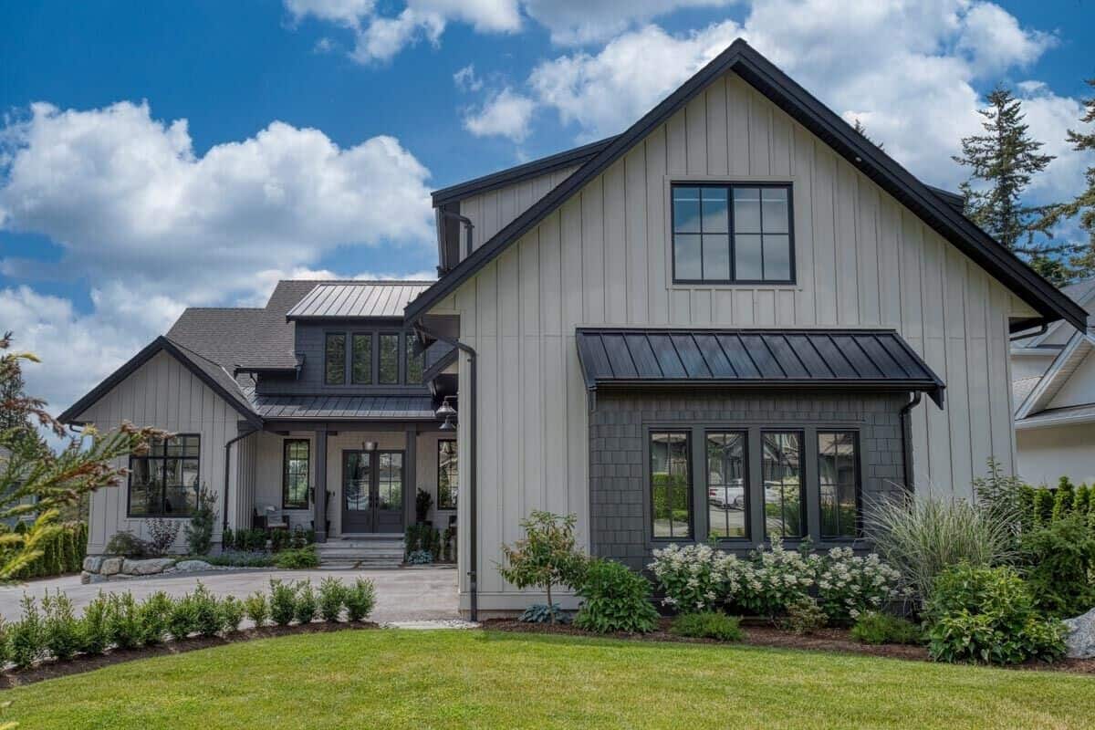 Front view of the house showcasing the covered entry porch topped with a large shed dormer.